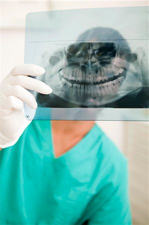 Dentist holding dental panoramic xray Stock Photo - Premium Royalty-Free, Code: 644-03659551