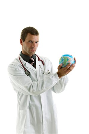 personale di terra - Doctor holding globe Fotografie stock - Premium Royalty-Free, Codice: 644-03659598