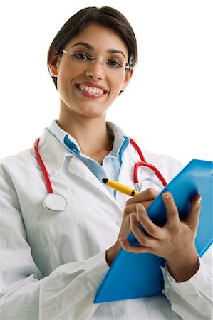 Doctor wearing stethoscope and writing on chart Foto de stock - Sin royalties Premium, Código: 644-03659614