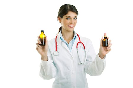 Doctor holding medicine bottles Stock Photo - Premium Royalty-Free, Code: 644-03659619