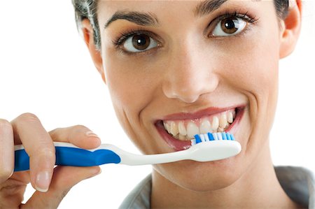 Young woman holding toothbrush Foto de stock - Sin royalties Premium, Código: 644-03659635