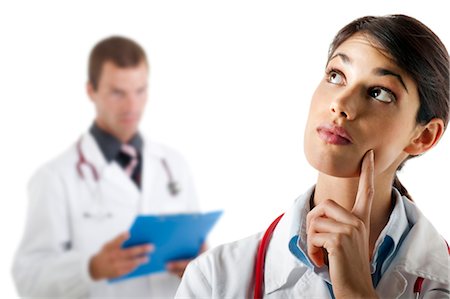 solution - Doctor questioning and doctor with medical chart Stock Photo - Premium Royalty-Free, Code: 644-03659631