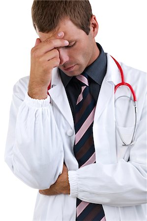 Worried doctor with hand on his head Stock Photo - Premium Royalty-Free, Code: 644-03672140