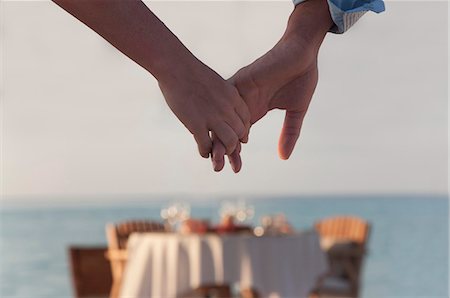 romantic dinner couple - Couple holding hands Stock Photo - Premium Royalty-Free, Code: 649-04247566