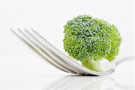 Close up of broccoli on fork Foto de stock - Sin royalties Premium, Código: 649-04248452