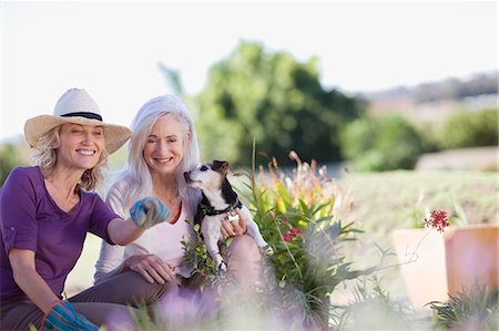 senior with dogs - Older women examining garden together Stock Photo - Premium Royalty-Free, Code: 649-04827291