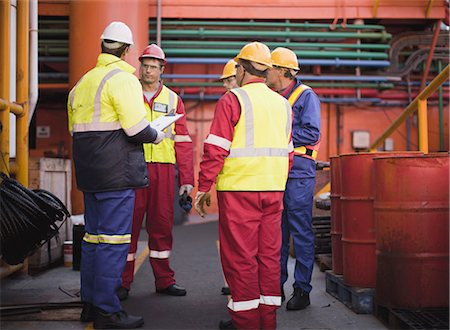 people working on oil rig - Workers talking on oil rig Stock Photo - Premium Royalty-Free, Code: 649-04827692