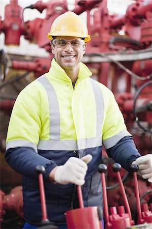 pipe work - Worker operating machinery on oil rig Stock Photo - Premium Royalty-Free, Code: 649-04827710