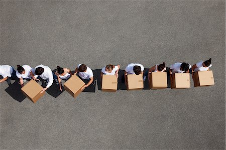 people line overhead - People passing cardboard boxes Stock Photo - Premium Royalty-Free, Code: 649-05520720