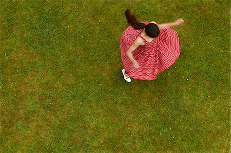 freedom not looking at camera horizontal - Woman spinning outdoors Stock Photo - Premium Royalty-Free, Code: 649-05520731