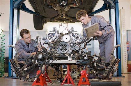 engine - Mechanics working on car engine Stock Photo - Premium Royalty-Free, Code: 649-05521265