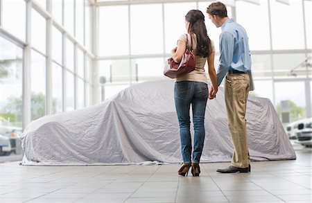 simsearch:649-05521296,k - Couple admiring new car under cloth Stock Photo - Premium Royalty-Free, Code: 649-05521285