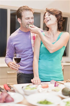 Couple eating and cooking dinner Stock Photo - Premium Royalty-Free, Code: 649-05521637