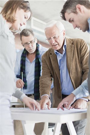 senior office - Architects reading blueprints in office Stock Photo - Premium Royalty-Free, Code: 649-05521892