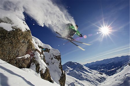 simsearch:649-03817453,k - Skier in midair on snowy mountain Stock Photo - Premium Royalty-Free, Code: 649-05522272