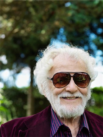 sunglasses portrait - Smiling older man wearing sunglasses Stock Photo - Premium Royalty-Free, Code: 649-05555656