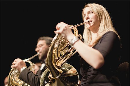 female musician - French horn players in orchestra Stock Photo - Premium Royalty-Free, Code: 649-05555735