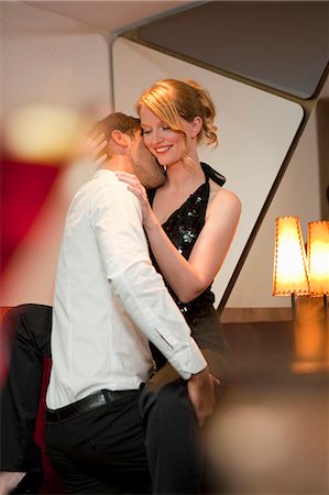 elegant couple embracing - Smiling couple dancing in bar Stock Photo - Premium Royalty-Free, Code: 649-05556309