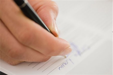 pen and paper - Close up of woman writing Stock Photo - Premium Royalty-Free, Code: 649-05648791