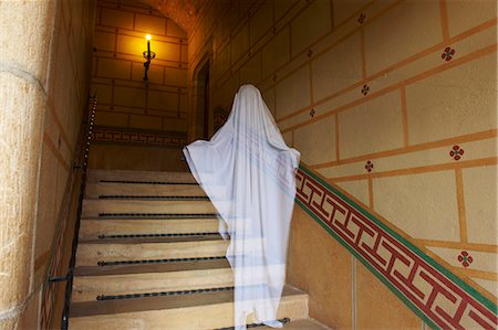 Ghost floating on ornate stairs Stock Photo - Premium Royalty-Free, Code: 649-05648944