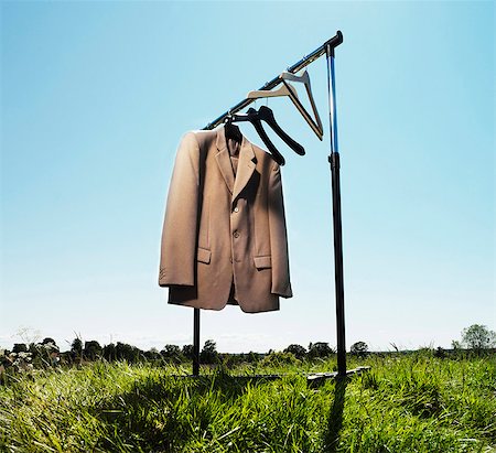 suit on rack - Suit jacket hanging in field Stock Photo - Premium Royalty-Free, Code: 649-05649162