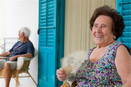 Older woman fanning herself outdoors Stock Photo - Premium Royalty-Free, Code: 649-05649276