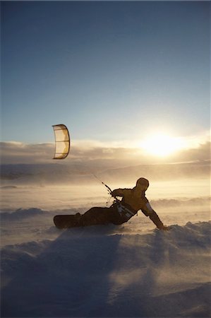 people snow sun - Man windsurfing on snowboard Stock Photo - Premium Royalty-Free, Code: 649-05649629