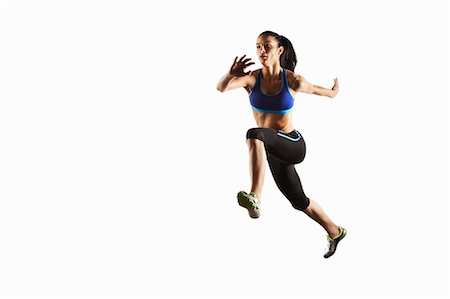 ponytail sideview - Athlete running in mid air Foto de stock - Sin royalties Premium, Código: 649-05656737