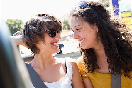 seatbelts - Women smiling together in convertible Stock Photo - Premium Royalty-Free, Code: 649-05656819