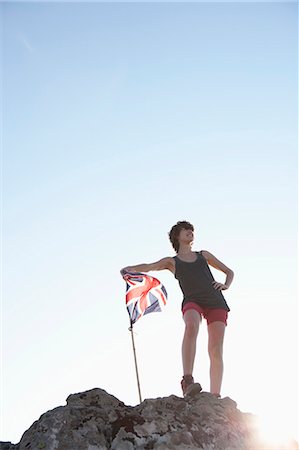 proud - Hiker planting Union Jack flag Foto de stock - Sin royalties Premium, Código: 649-05656867