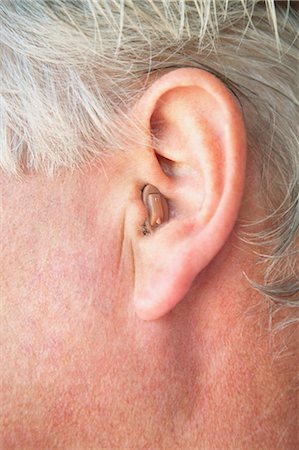 Close up of older person's hearing aid Stock Photo - Premium Royalty-Free, Code: 649-05656941