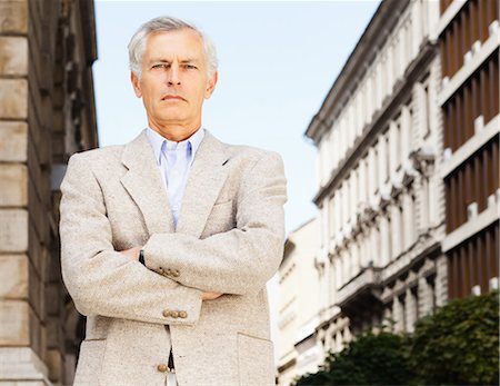 simsearch:649-05658209,k - Businessman standing with arms crossed Stock Photo - Premium Royalty-Free, Code: 649-05656996