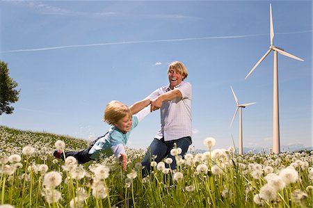 Father and son with wind turbines Stock Photo - Premium Royalty-Free, Code: 649-05657717