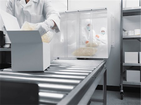embalaje - Scientist working on assembly line Foto de stock - Sin royalties Premium, Código: 649-05657760