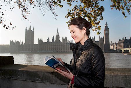 Woman reading guidebook of London Stock Photo - Premium Royalty-Free, Code: 649-05658267