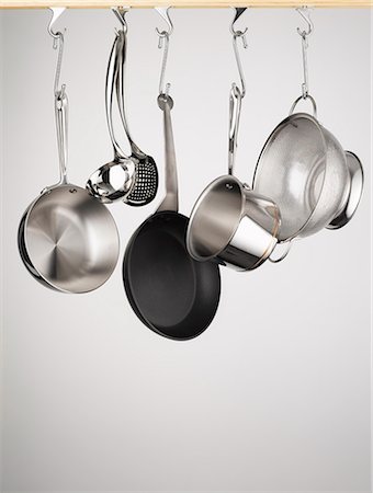 strainer - Pots and pans hanging from hooks Stock Photo - Premium Royalty-Free, Code: 649-05800944