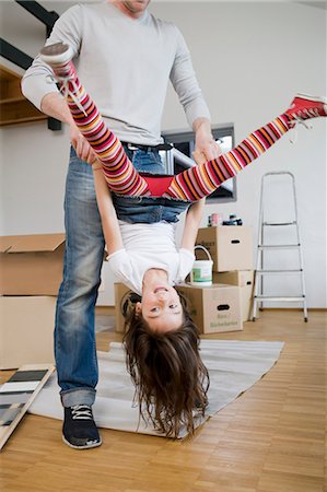 dangling - Father and daughter playing in new house Stock Photo - Premium Royalty-Free, Code: 649-05801078