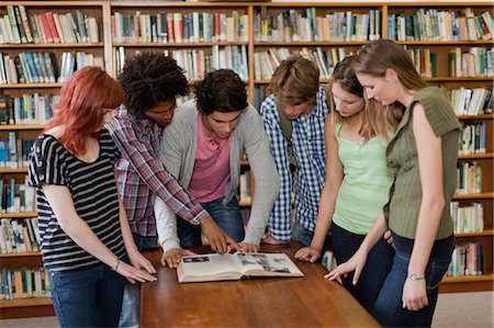 project (a specific task) - Students reading book in library Stock Photo - Premium Royalty-Free, Code: 649-05801368