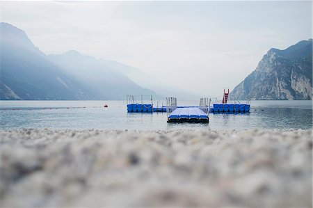 pebbles on beach - Floating pier off rocky beach Stock Photo - Premium Royalty-Free, Code: 649-05801450