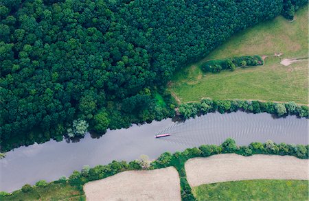 southern england - Aerial view of boat in rural river Stock Photo - Premium Royalty-Free, Code: 649-05801679