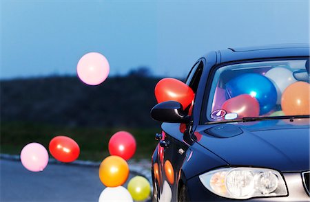 photography and night and moving images - Colorful balloons coming out car window Stock Photo - Premium Royalty-Free, Code: 649-05801809