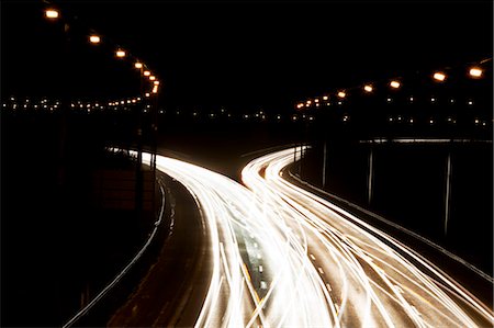simsearch:6102-06965609,k - Time-lapse view of traffic at night Stock Photo - Premium Royalty-Free, Code: 649-05801811