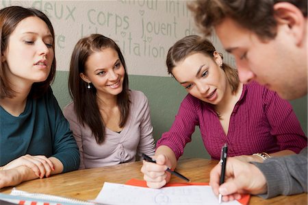 dining, side view - Students studying together in cafe Stock Photo - Premium Royalty-Free, Code: 649-05802133