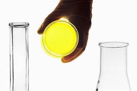 flask beaker - Scientist holding glowing petri dish Stock Photo - Premium Royalty-Free, Code: 649-05802196