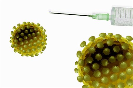 Close up of virus atoms and syringe Stock Photo - Premium Royalty-Free, Code: 649-05802201