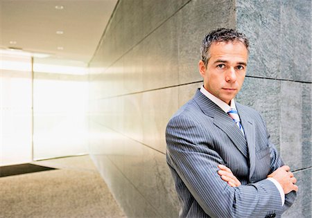 simsearch:649-05658209,k - Businessman standing in office Stock Photo - Premium Royalty-Free, Code: 649-05802235