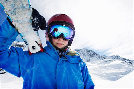 sport and ski - Boy holding skis on snowy mountain Stock Photo - Premium Royalty-Free, Code: 649-05819581