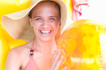 swimming suits for 12 years old girls - Teenage girl in braces wearing sunhat Stock Photo - Premium Royalty-Free, Code: 649-05819676