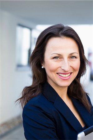 portrait and head shot and business - Close up of businesswomans smiling face Stock Photo - Premium Royalty-Free, Code: 649-05819774