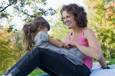 family tickling - Mother and daughter playing outdoors Stock Photo - Premium Royalty-Free, Code: 649-05819854